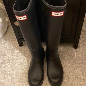 Tall black hunter boots